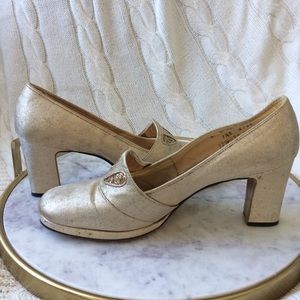 Vintage gold heels with embellishment.